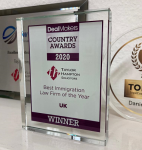 photo of Taylor Hampton Immigration department's awards Trophy