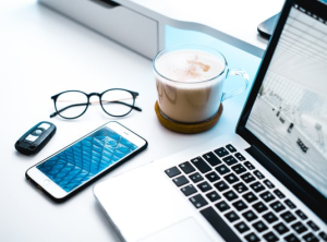 Photo of home office with coffee and PC