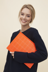 Colour photo of a student with folder