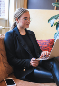 Photograph of a job seeker seated with laptop