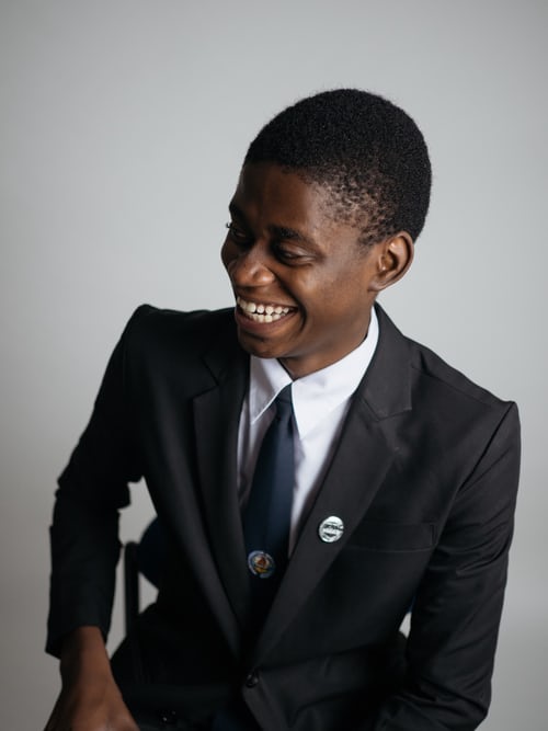 Photograph of a gentleman in a suit the windrush affair relating to the windrush generation article