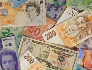 Photo of international currency for fee waivers for immigration applications