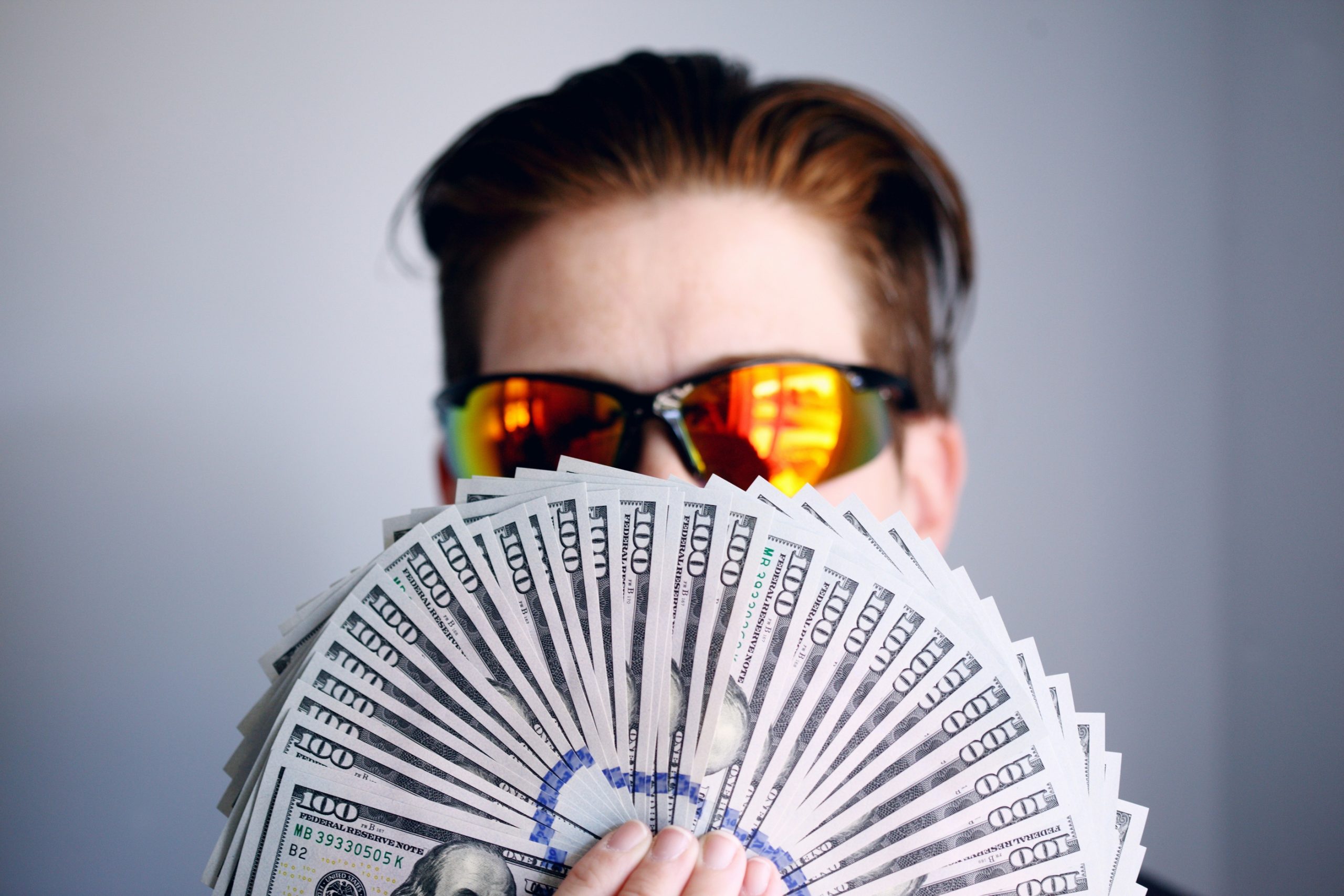 Rich american wealthy american with dollars taylor hampton solicitors